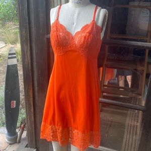 VINTAGE bright orange polyester slip.